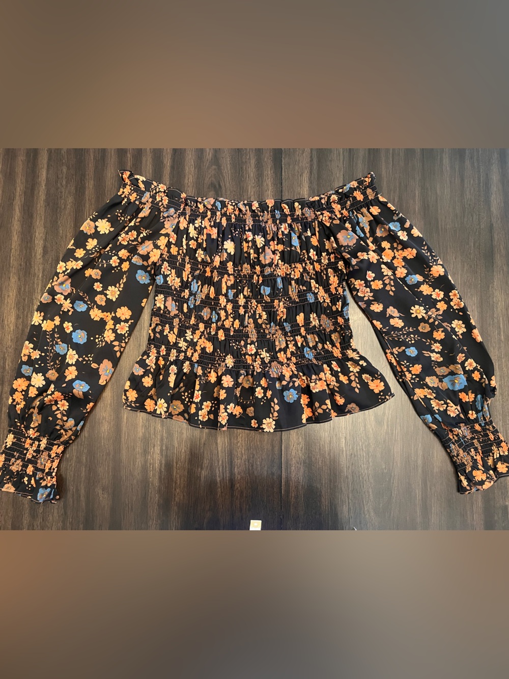 Kori Black Off-Shoulder Smocked Floral Top with Orange and Blue Flowers